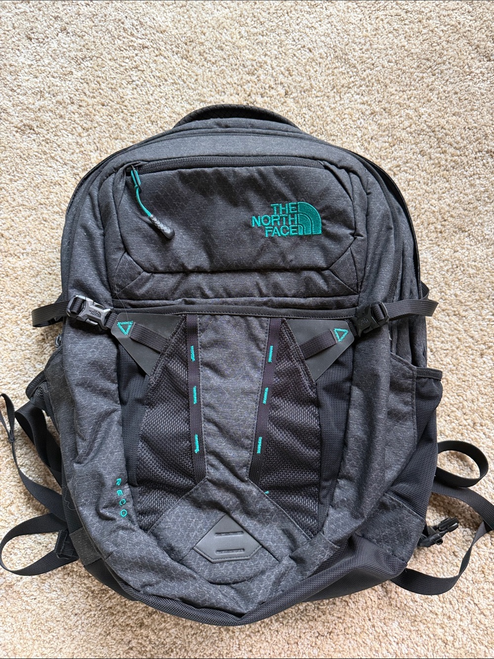 The North Face Gray Backpack with Teal Stitching and Logo